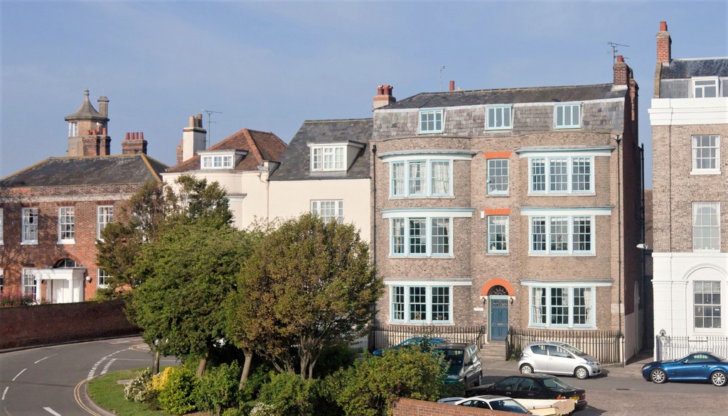 town house with trees in front