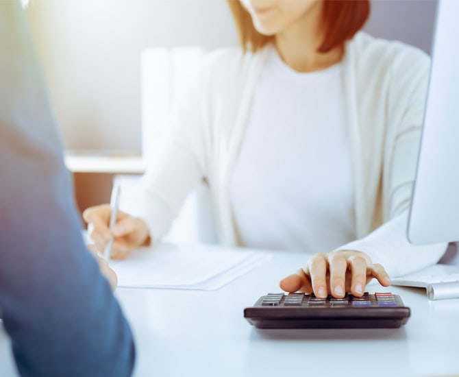 A person using a calculator